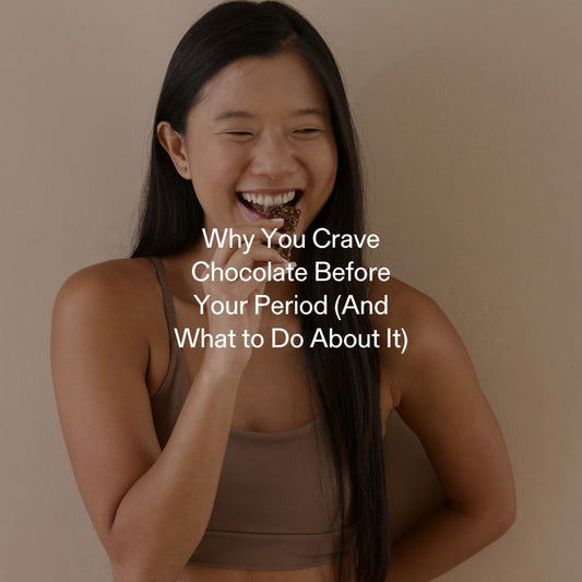 Woman eating chocolate to satisfy premenstrual craving