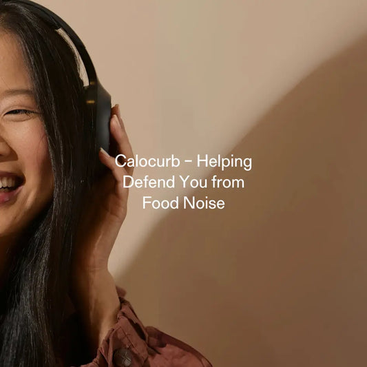 Smiling woman using Calocurb to block food noise with natural GLP-1 support